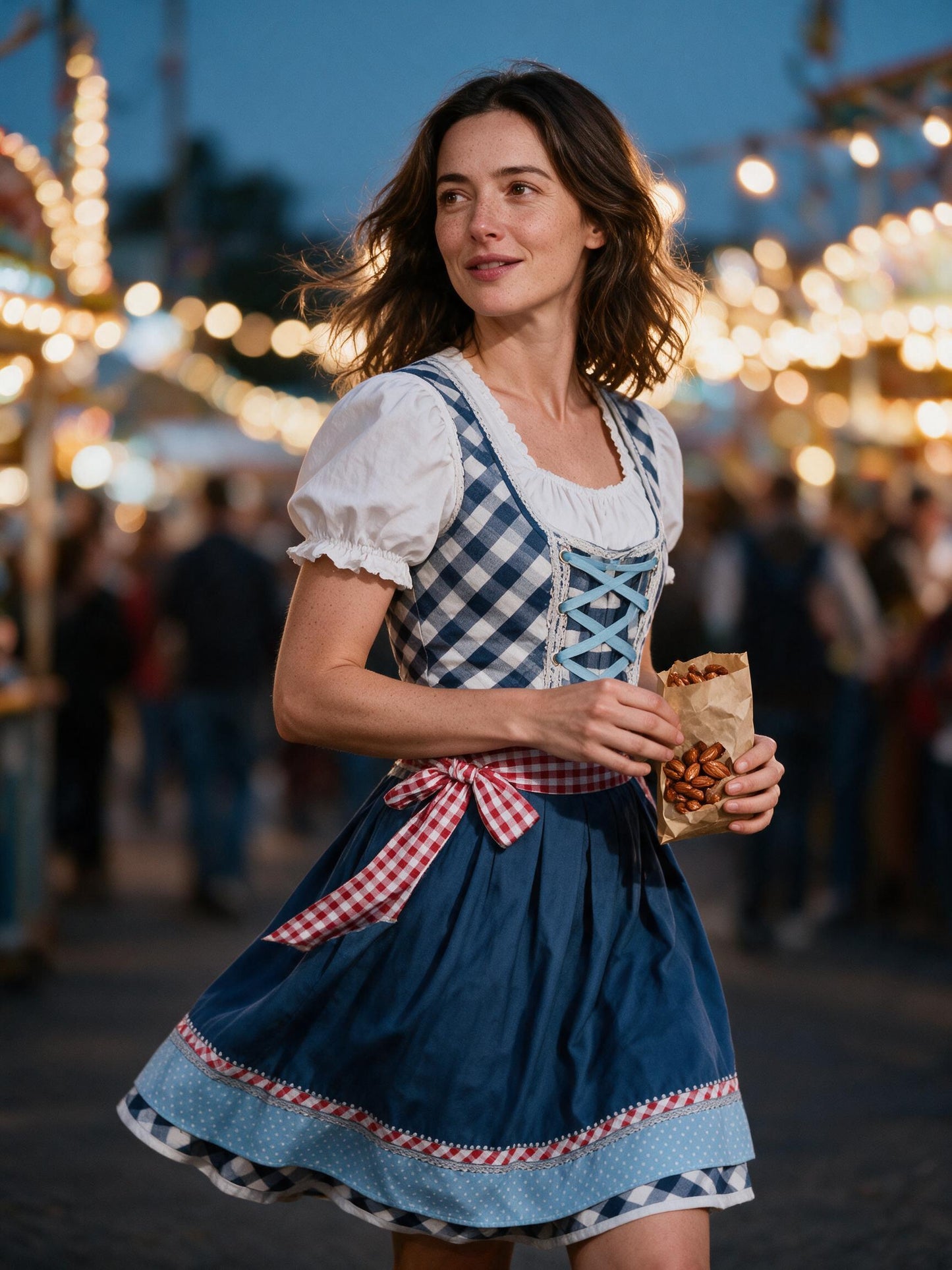 Woman in the blue plaid dirndl set at a Volksfest fairground in the evening