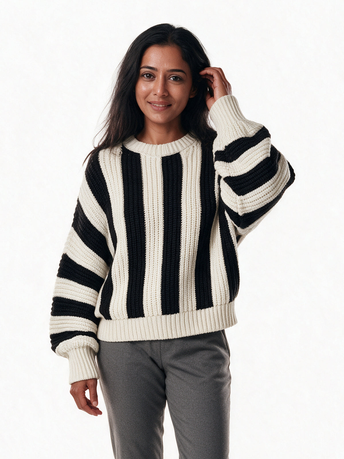 Amelia cream and black striped chunky knit sweater, front view on a white studio background