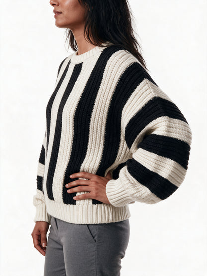 Close detail of the Amelia sweater, ribbed knit texture and broad black and cream stripes