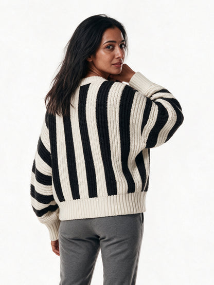 Back view of the Amelia striped knit sweater showing the boxy body and ribbed hem