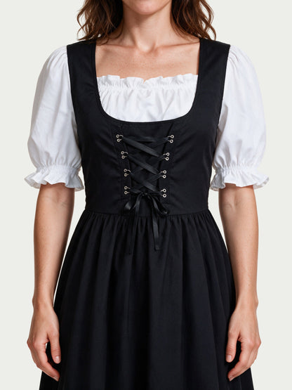 Close detail of the square neckline, silver eyelets and black ribbon lacing on the Lorelei dress