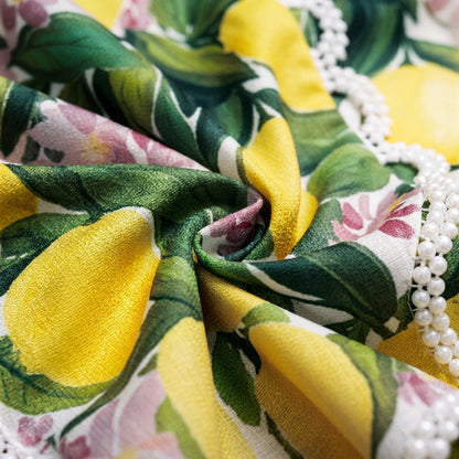 Drape test of Naomi lightweight tropical print dress fabric with pearls