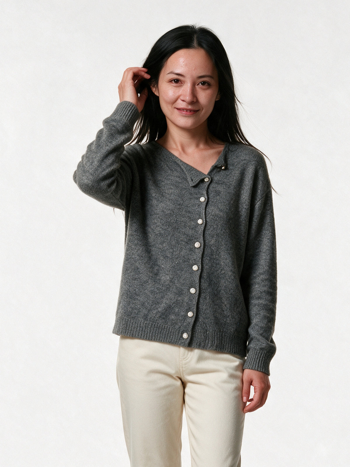 Perla grey fine knit cardigan with an off-centre button placket, front view on a white studio background