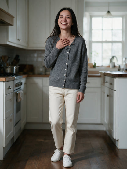 Perla grey cardigan worn in a bright kitchen in morning light