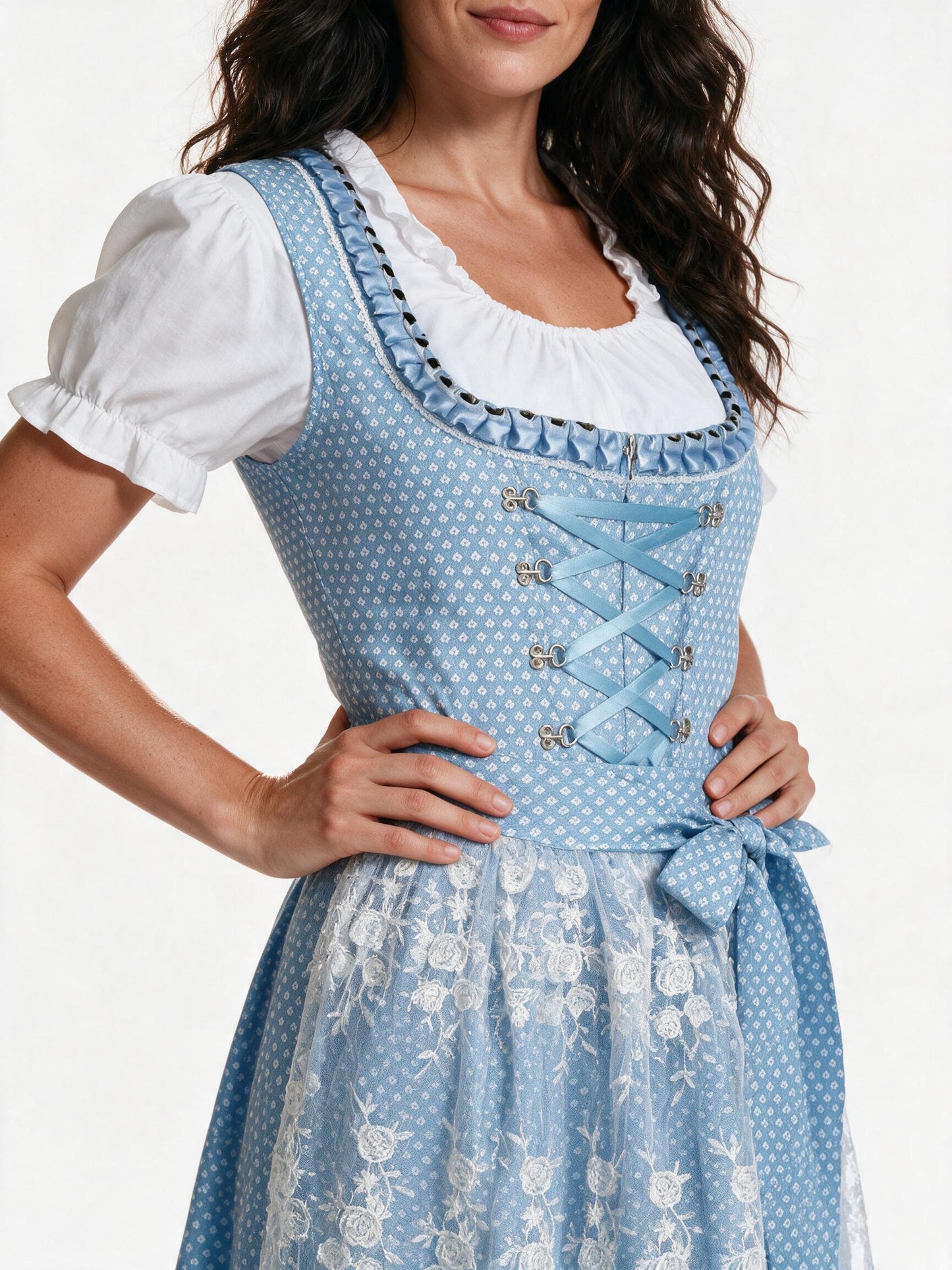 Close detail of the silver hook lacing and floral lace overlay apron