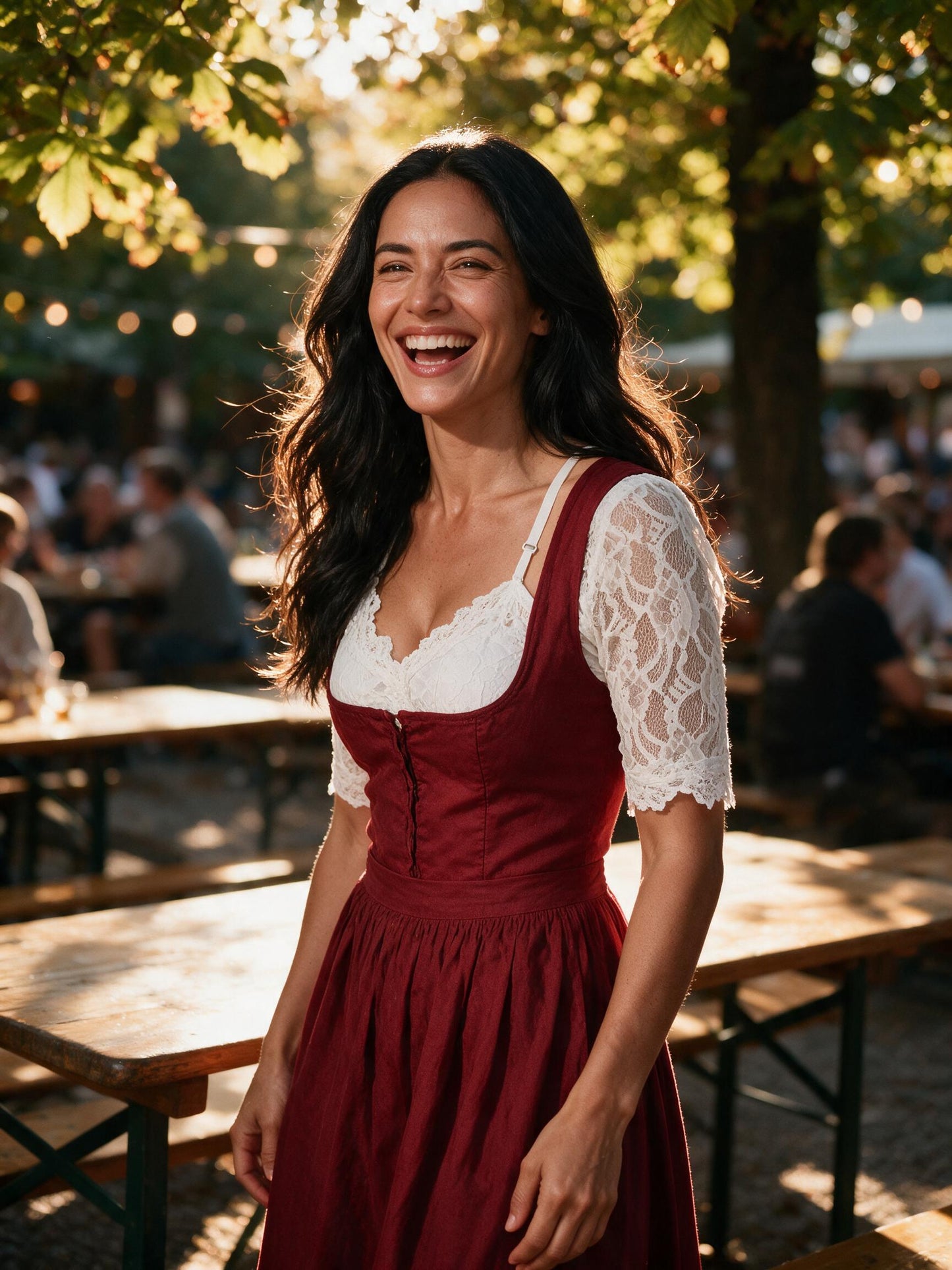 White lace dirndl blouse worn under a red dirndl in a beer garden