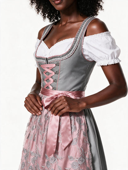 Close detail of the pink ribbon lacing and embroidered lace apron