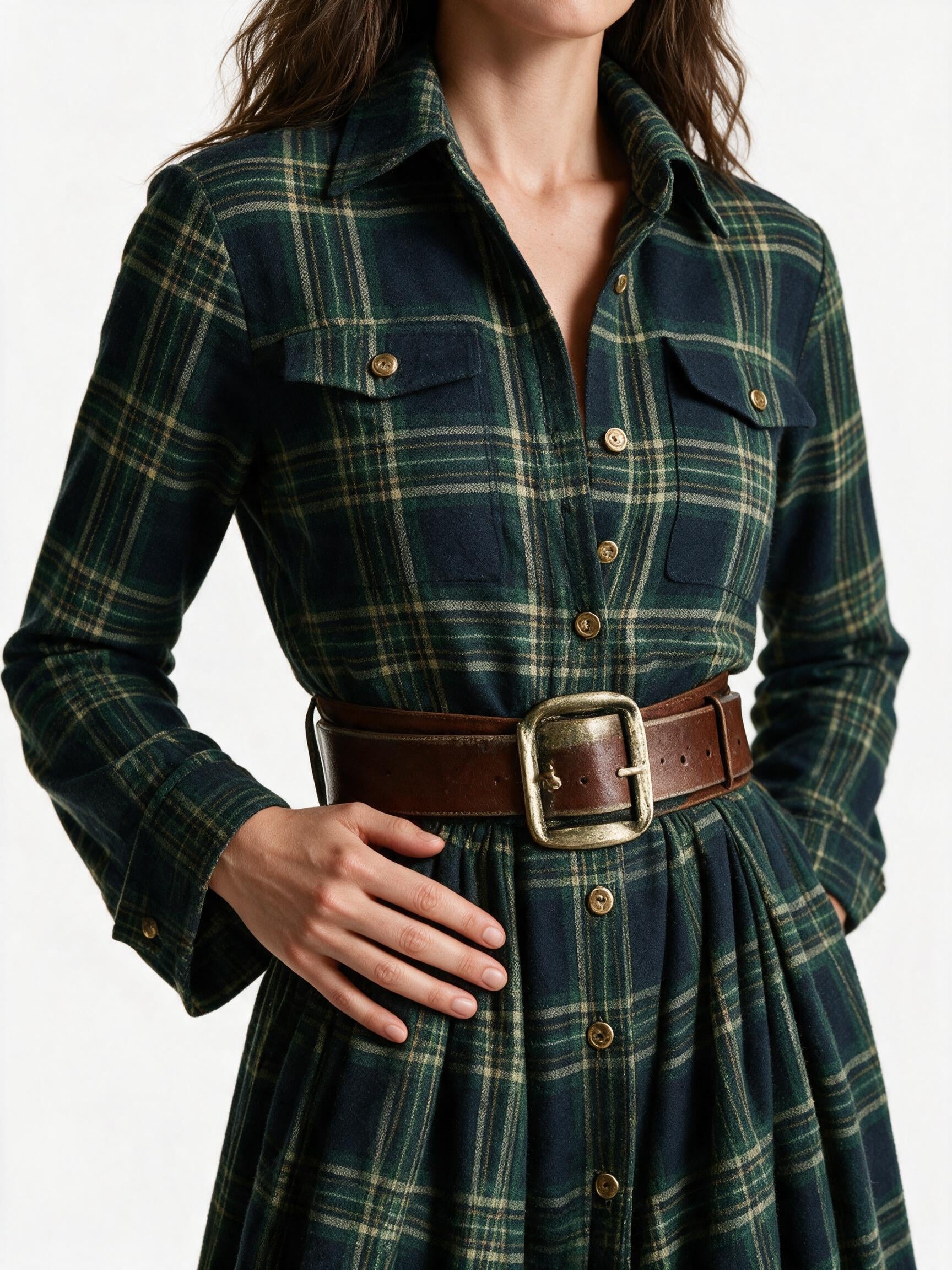 Close-up of the Marlowe brushed tartan cloth, flap chest pocket and antique brass belt buckle