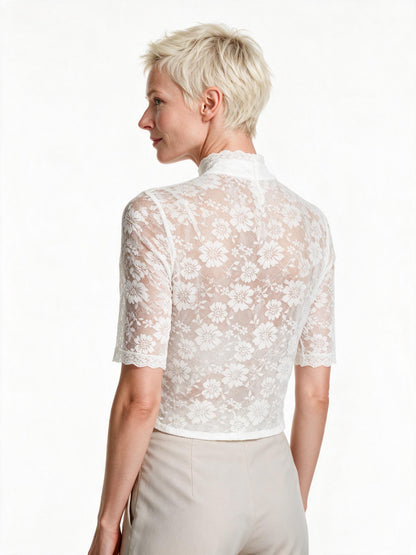 High neck white lace dirndl blouse, back view showing the stand collar