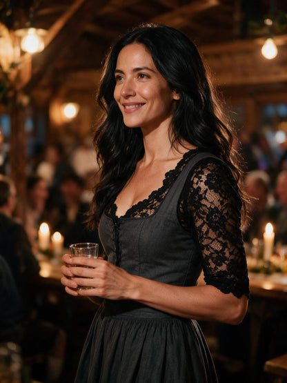 Black lace dirndl blouse under a charcoal dirndl at an evening Trachten party