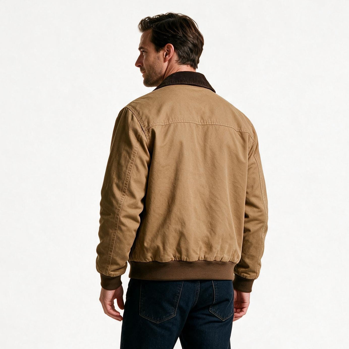 Back view of the men's canvas work jacket showing the shoulder seams and ribbed waist hem