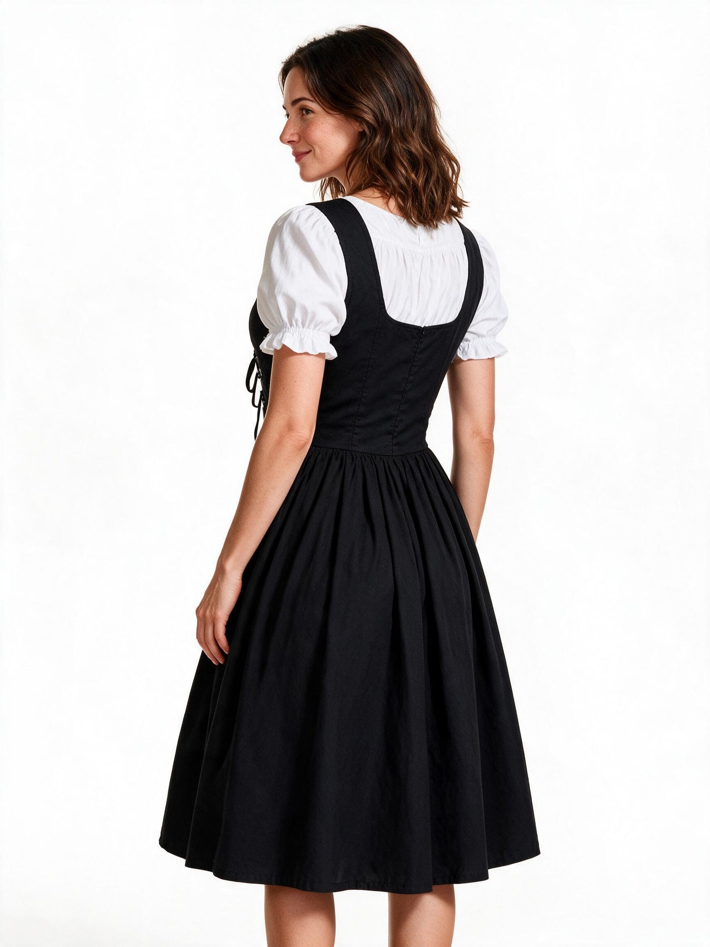 Black lace up maid dress, back view showing bodice seams and full skirt