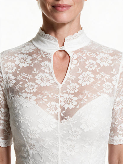 Close detail of the lace stand collar and keyhole opening