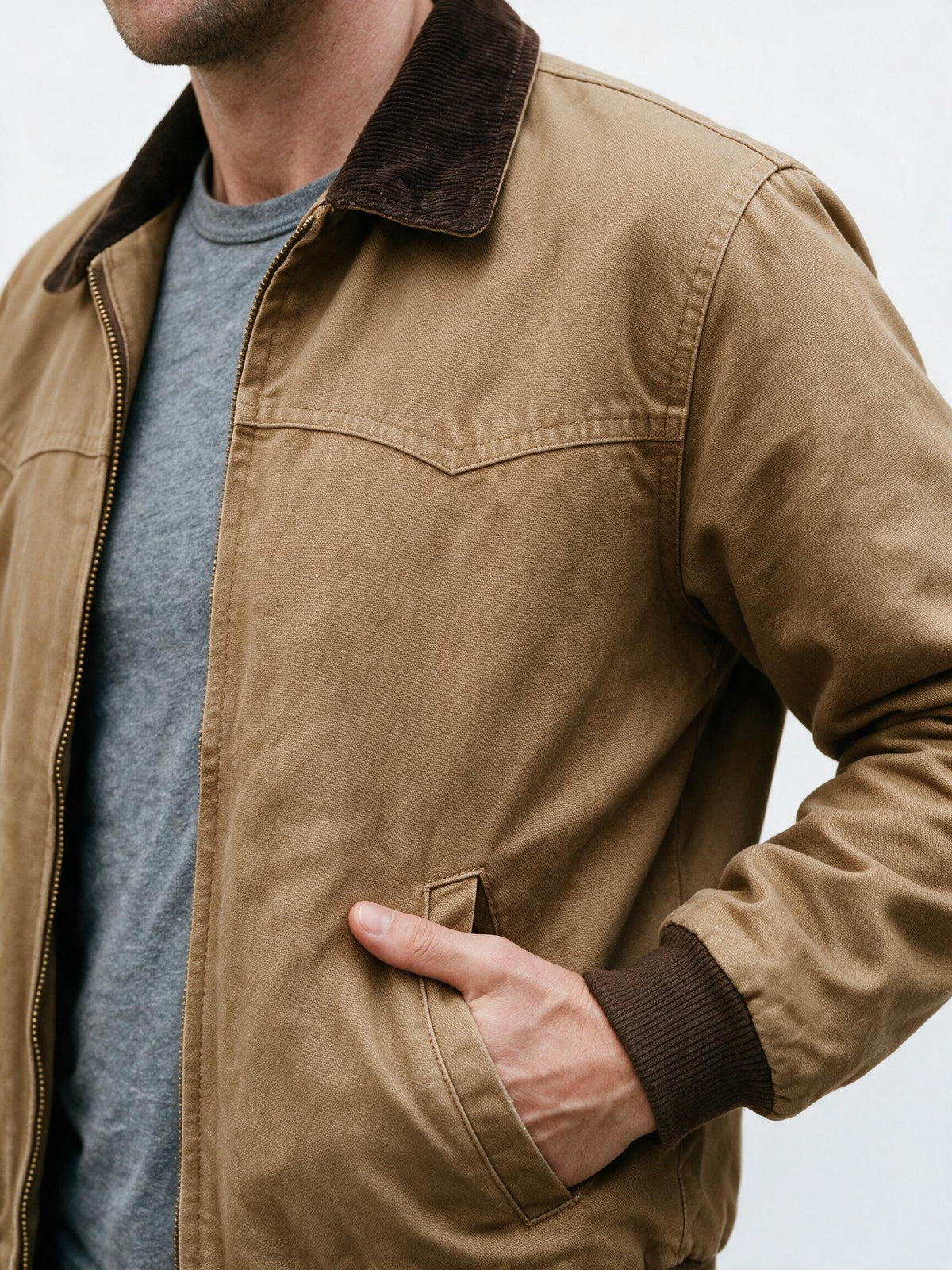 Close-up of the work jacket's corduroy collar, brass zip and cotton canvas weave