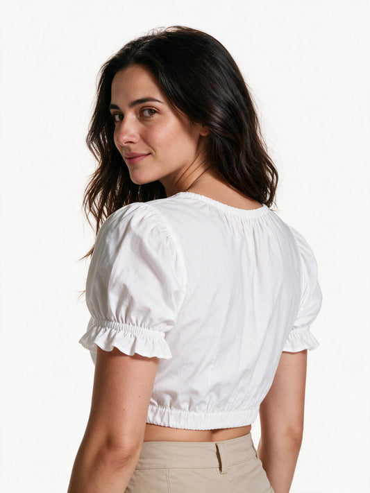 White dirndl blouse, back view showing the gathered panel and elastic hem