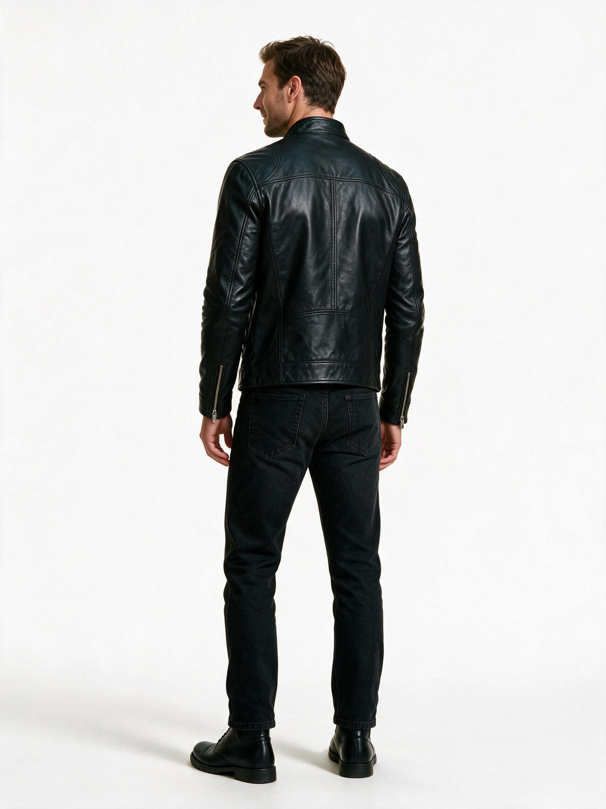 Back view of the black motorcycle jacket showing the shoulder panel seams and hip-length hem