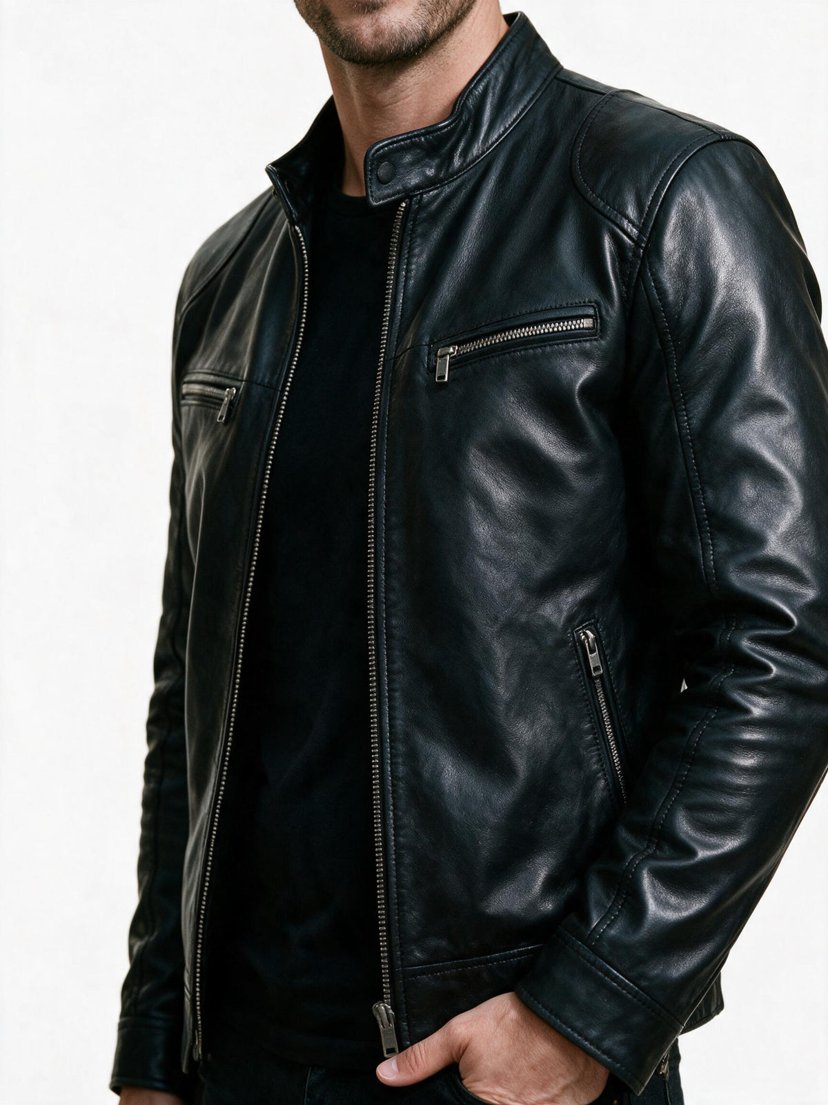 Close-up of the motorcycle jacket's stand collar snap tab, front zip and chest pocket zip
