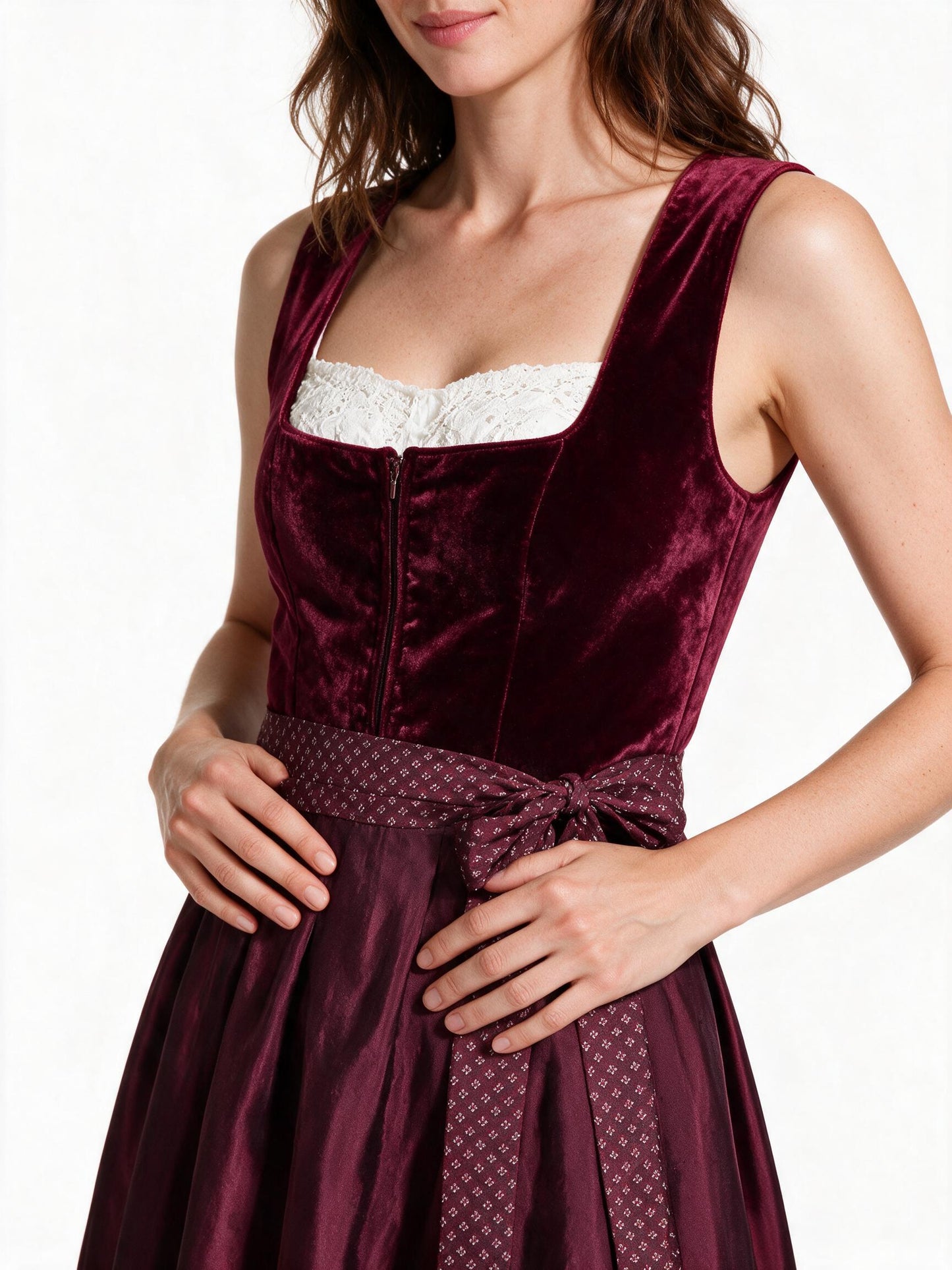 Close detail of the velvet bodice, white lace panel and patterned apron