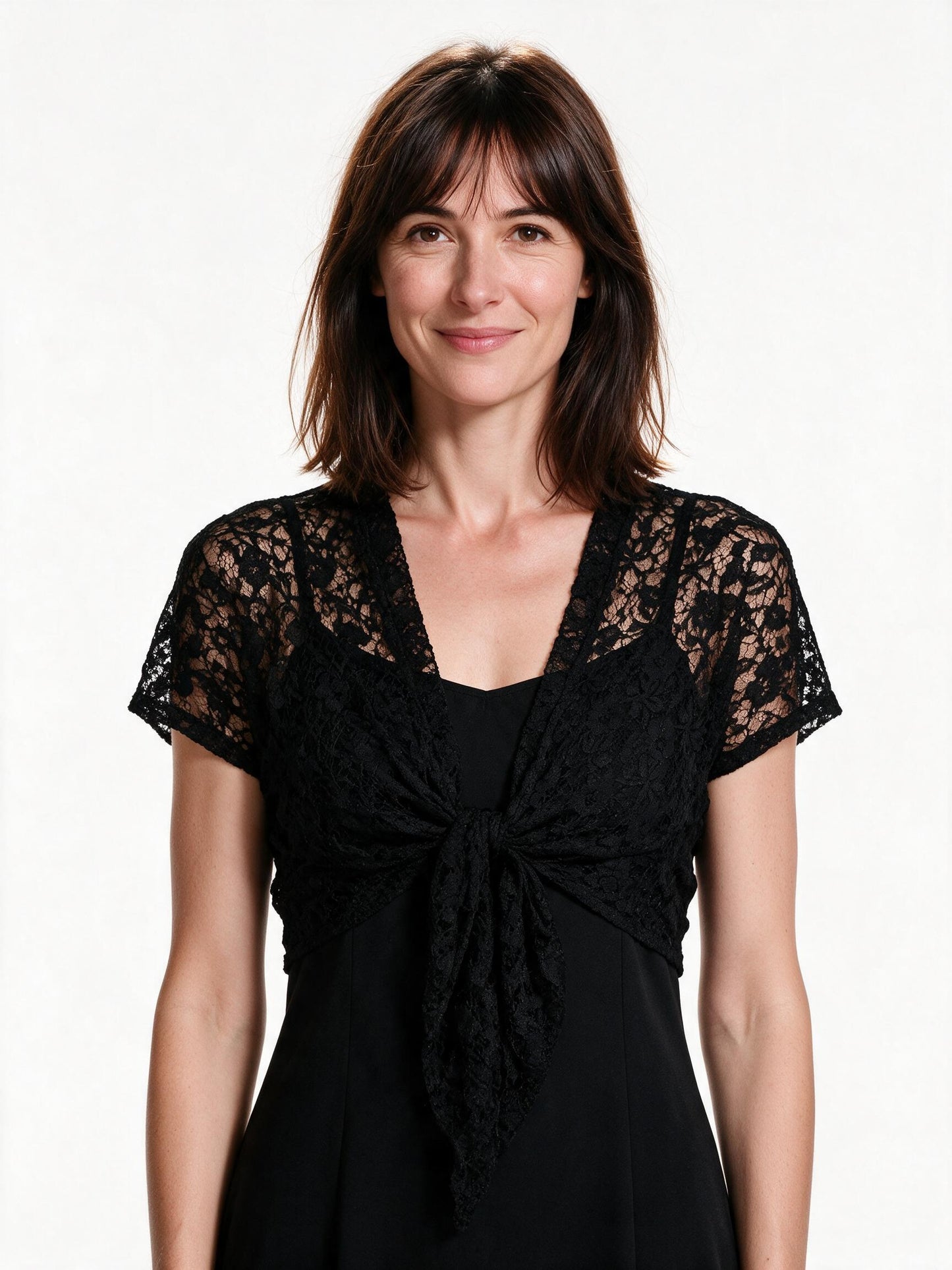 Black lace tie-front bolero shrug with short sleeves, front view on white